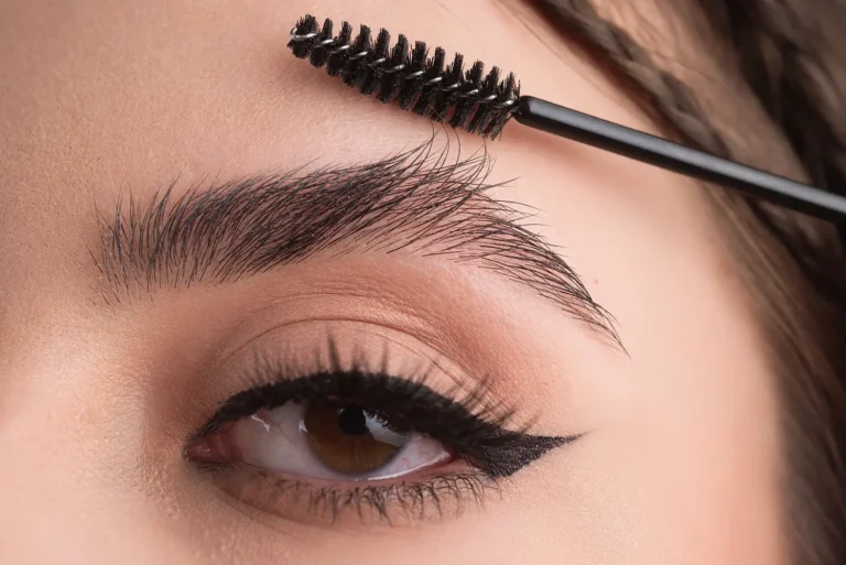 closeup-eyebrows-with-eyebrow-brush-close-up-brows-eyebrows-lamination-brow-procedures-long-eyelashe copy