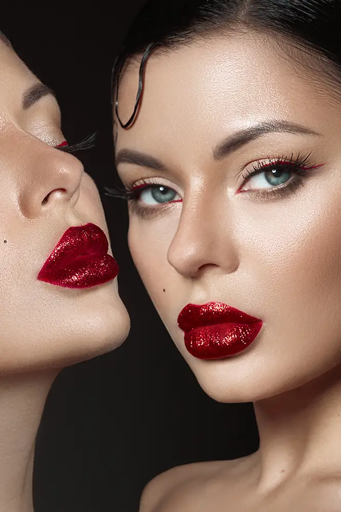 two-models-display-bold-red-lips-intricate-makeup-highlighting-artistry-cosmetics-perfect-lighting-accentuates-their-features-creating-alluring-beauty-moment copy